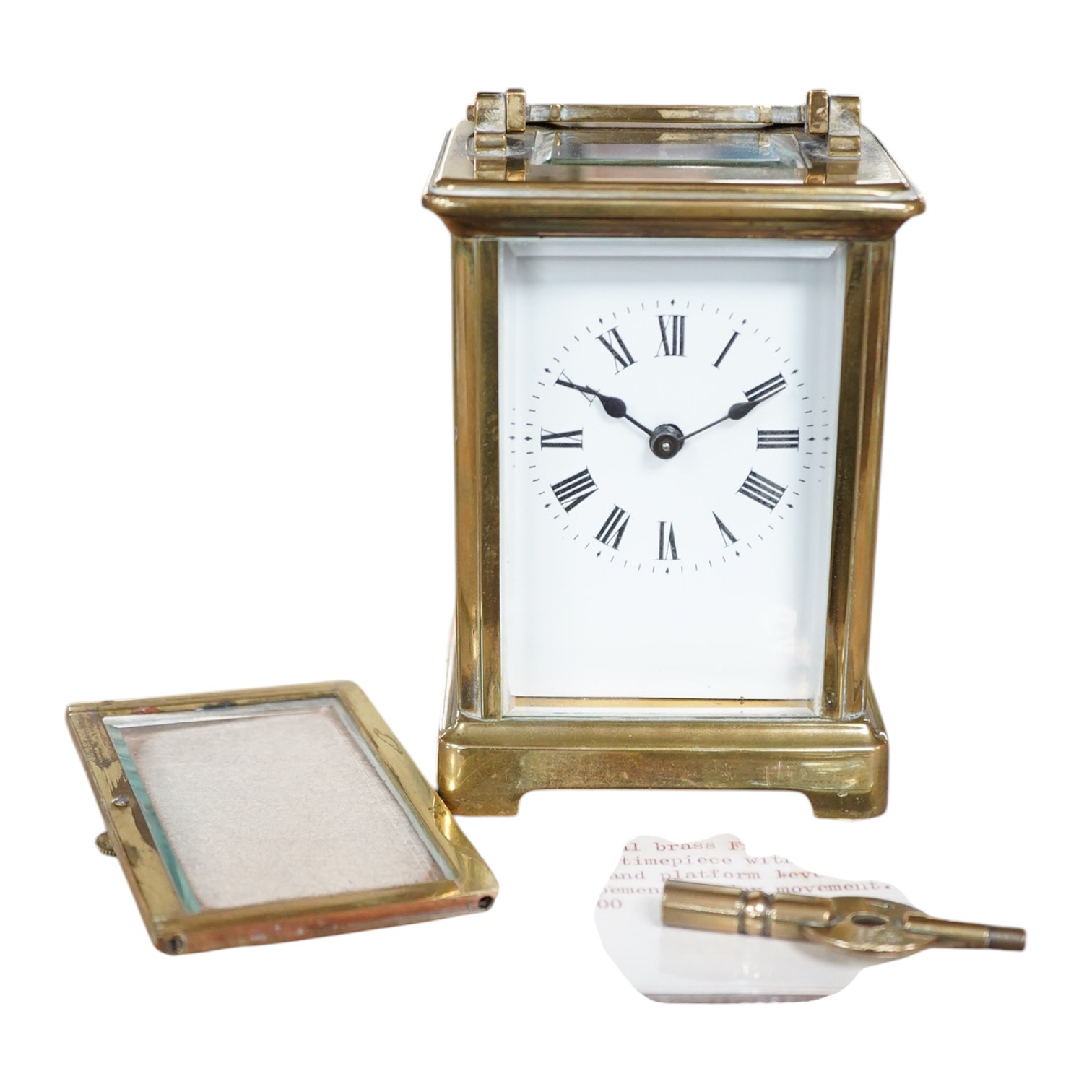 A late 19th century French brass cased eight day carriage timepiece with key, 14cm high. Condition - poor, untested